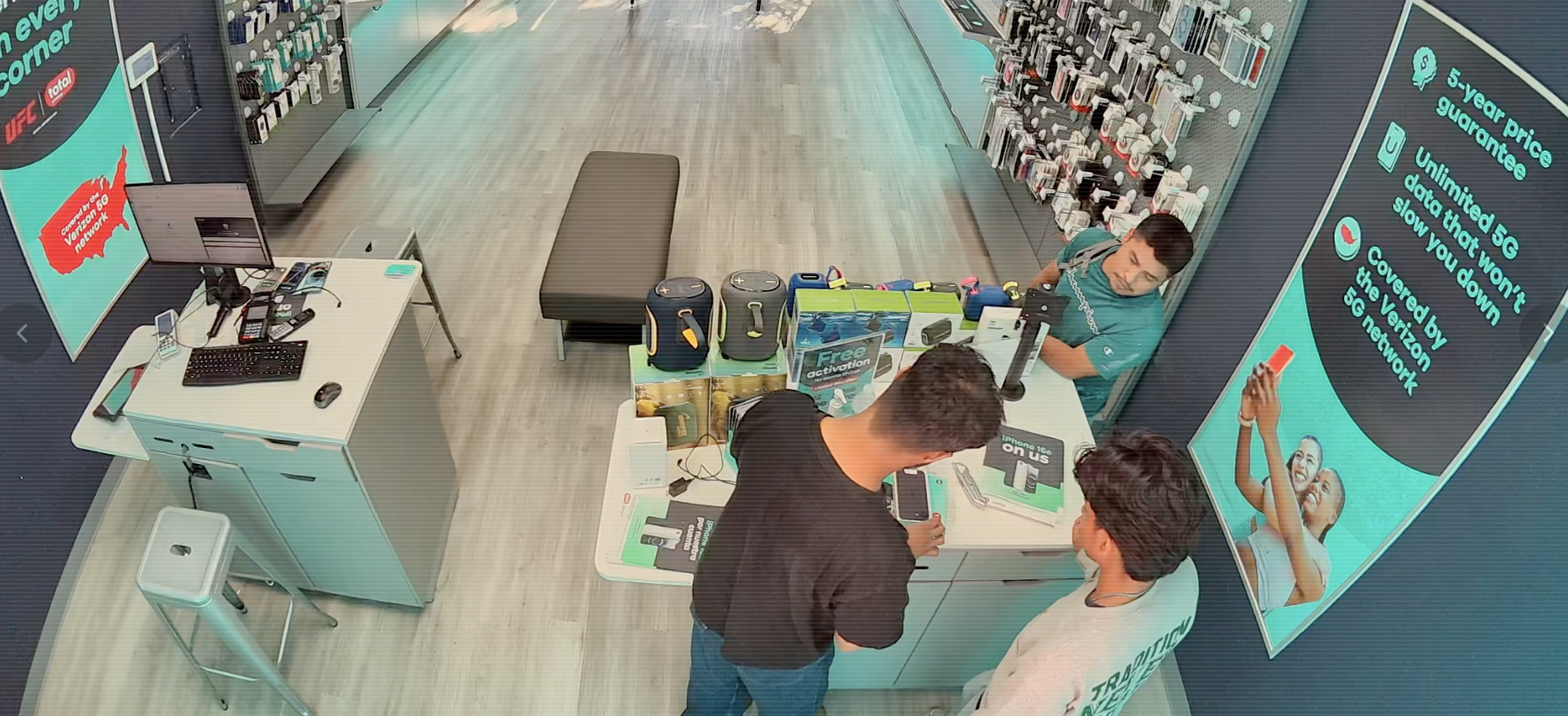 Surveillance view of a customer interaction at the Peachtree Blvd store